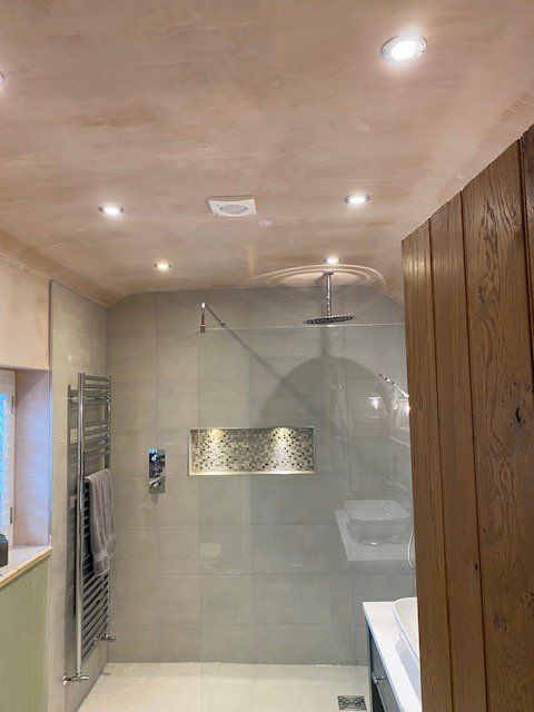 Shower area featuring a stylish illuminated light shelf installed by Jack Jones Electrician in Swadlincote and Derby, highlighting expert commercial lighting.